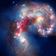 Illustration for article titled Antennae Galaxies are slowly colliding in beautiful chaos of black holes